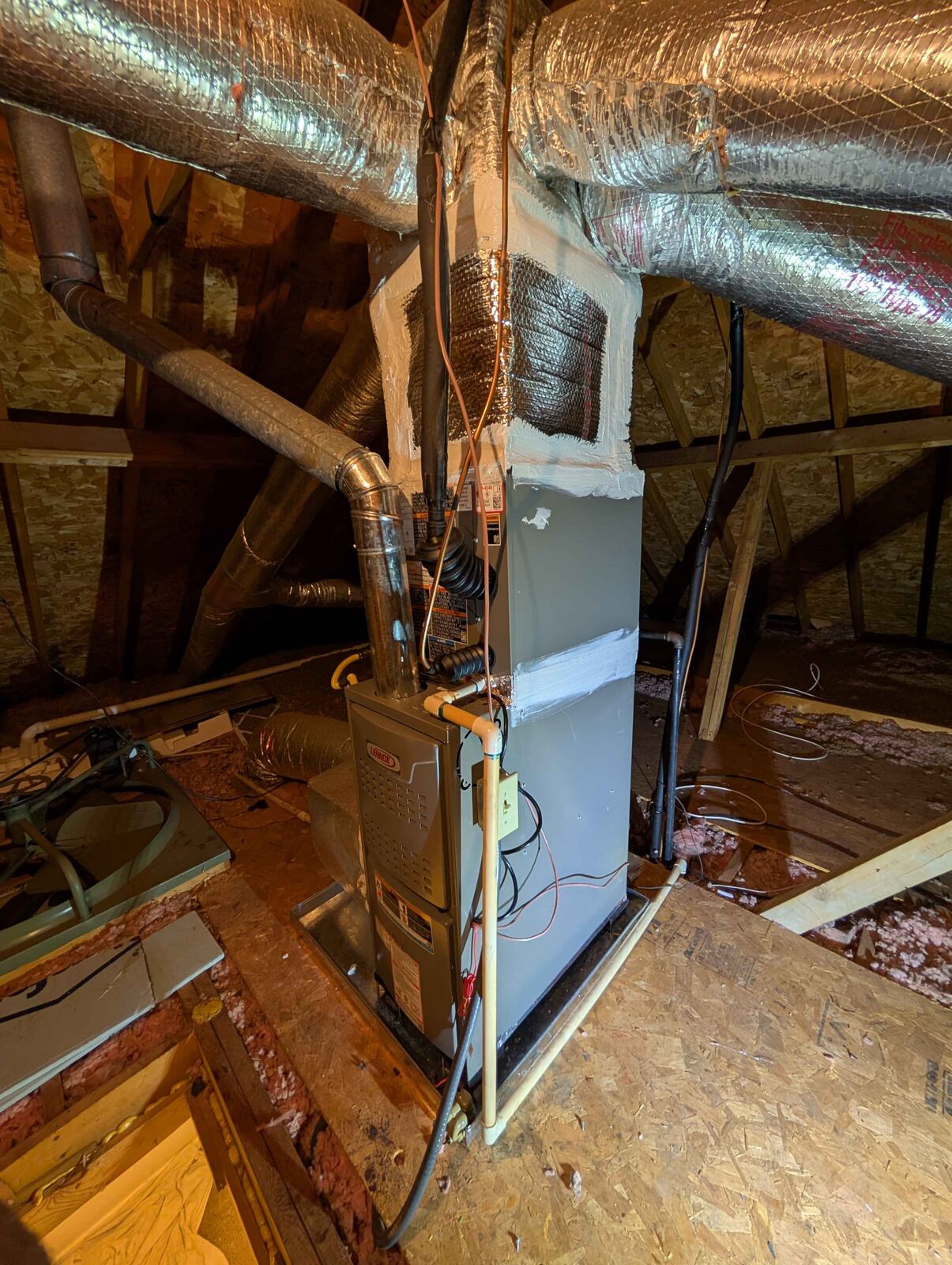 Chilly Willy Air technician's attic furnace installation